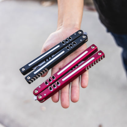 Dual Tone Mako V5 Red and Black side by side comparison on hand 