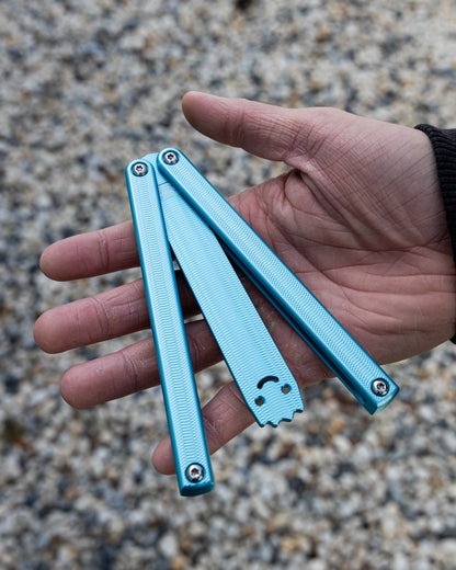 Glacial Squiddy-AL Semi Close Position On Hand on blurry pebble background