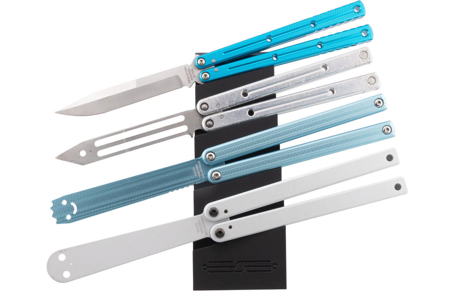 Set of folding knives on quad balisong stand on a white background