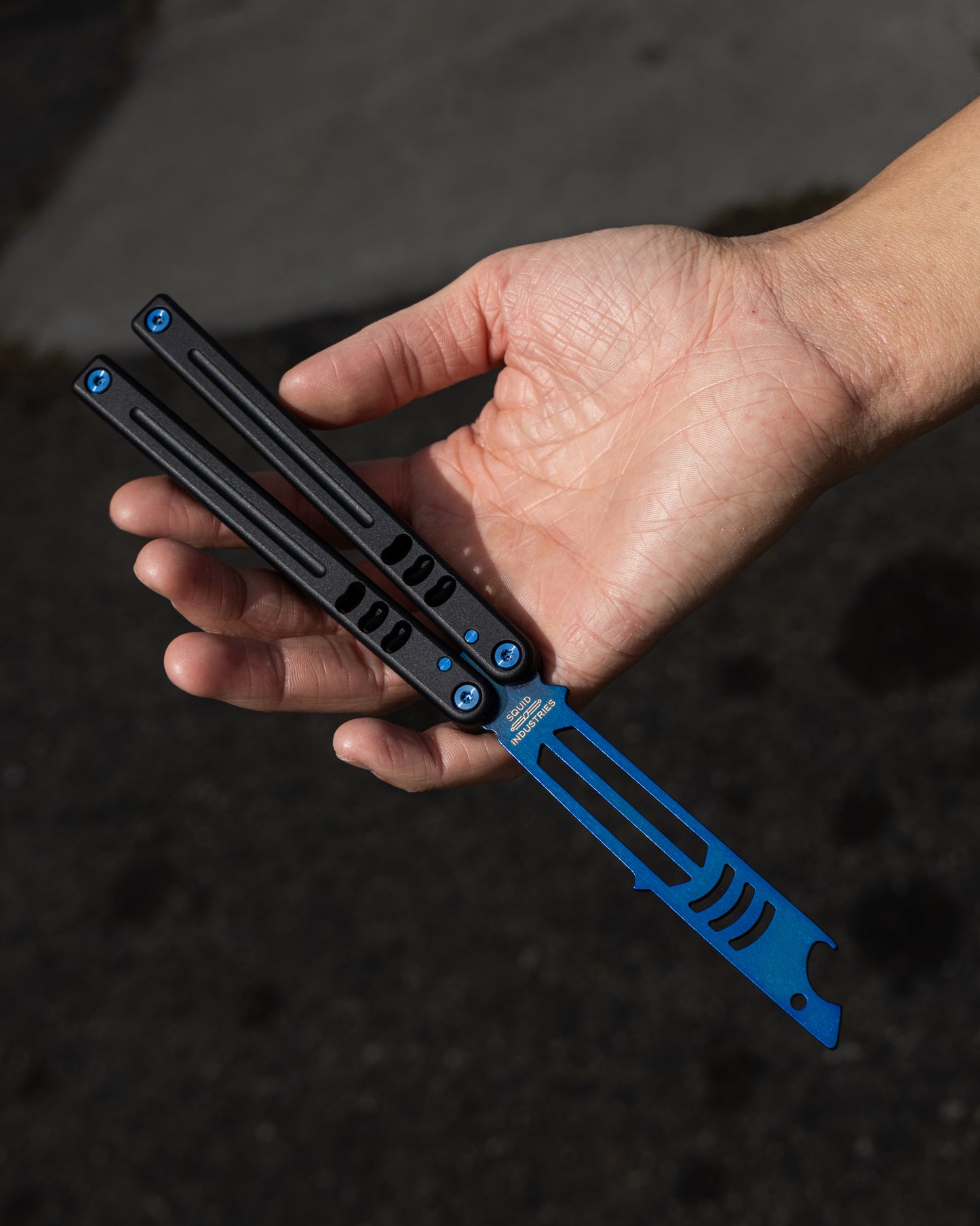 Sapphire Mako V5 Blue and Black in Open Position held by a hand