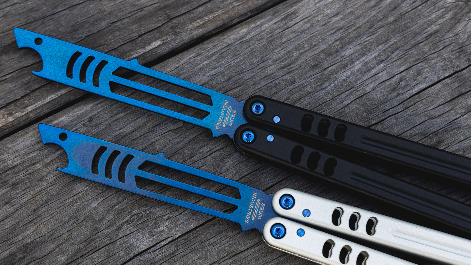 sapphire black and silver mako side by side on wooden table